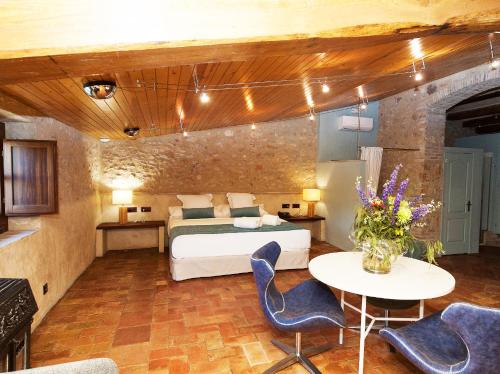 Katil atau katil-katil dalam bilik di Hotel Molí de l'Escala