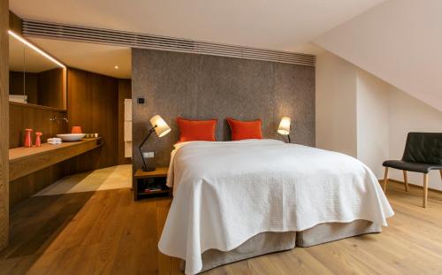 Ein Bett oder Betten in einem Zimmer der Unterkunft Hotel Schloss Gabelhofen