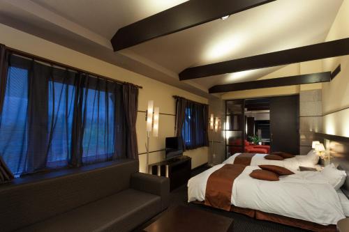 Voodi või voodid majutusasutuse Forest Hotel Rochefort toas