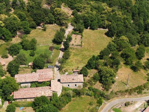 an aerial view of a house on a hill at Le Mas De La Siffleuse in Jaujac