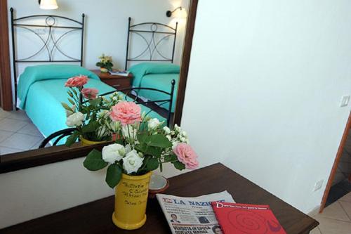 Postel nebo postele na pokoji v ubytování Locanda Dino