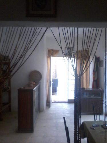 a living room with a large window and a table at Dana moon hostel in Dana