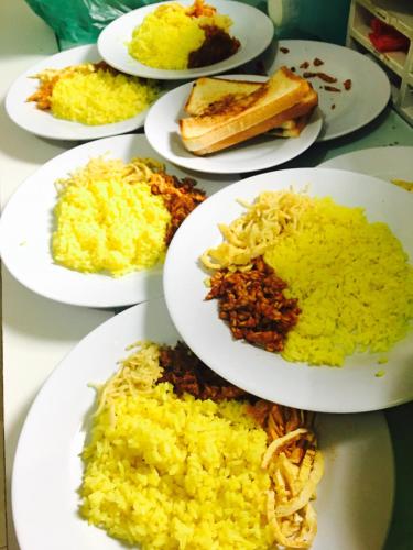 a group of plates of food on a table at Guest House Rumah Lombok Syariah in Mataram