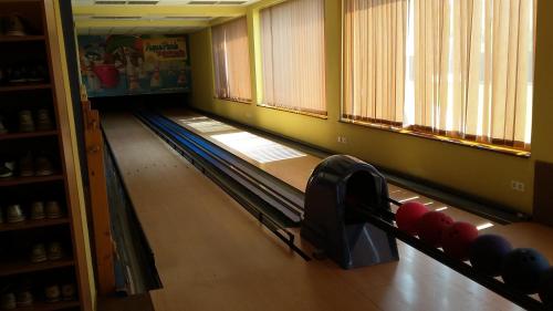 an empty bowling alley with a row of pins at Tatralandia Apartmán in Liptovský Mikuláš