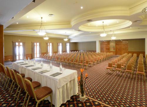 a large room with rows of tables and chairs at Vincci Saphir Palace & Spa in Hammamet