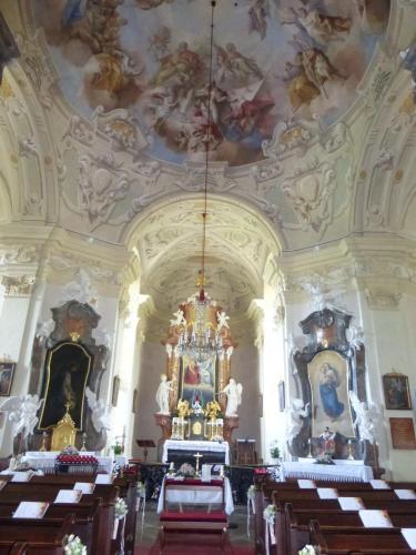an ornate church with a ceiling with paintings at Schlosshotel Rosenau Superior in Schloss Rosenau