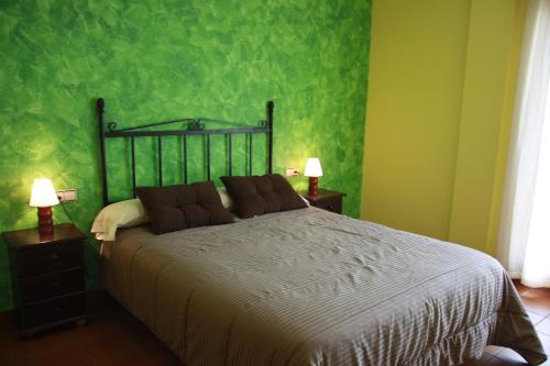 Ένα ή περισσότερα κρεβάτια σε δωμάτιο στο Hostal Gúdar