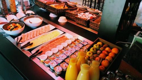 a buffet with many different types of food and drinks at Campanile Bourg-En-Bresse ~ Viriat in Viriat