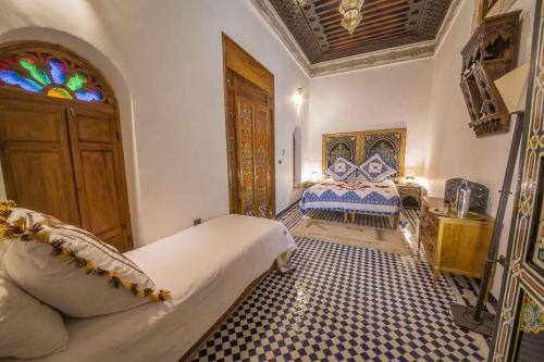 מיטה או מיטות בחדר ב-Riad Ouliya