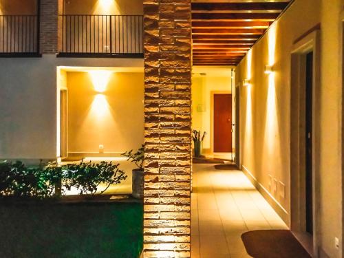 a hallway of a house with a brick wall at Hotel Relais Agli Olivi in Lazise