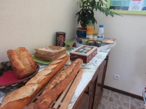 a counter topped with lots of loaves of bread at Armalou in Pouilly-sur-Loire