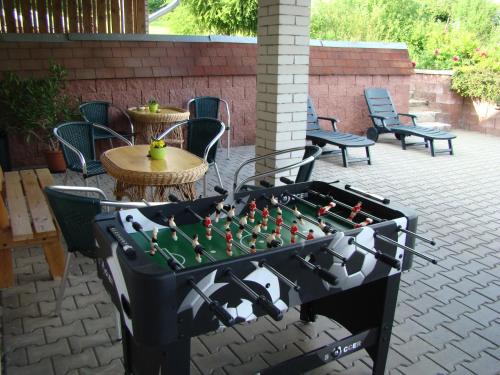 a game of foosball on a patio at Penzion Cabák in Vrchlabí