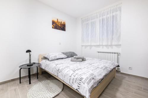 Postel nebo postele na pokoji v ubytování Apartments Lucky Place