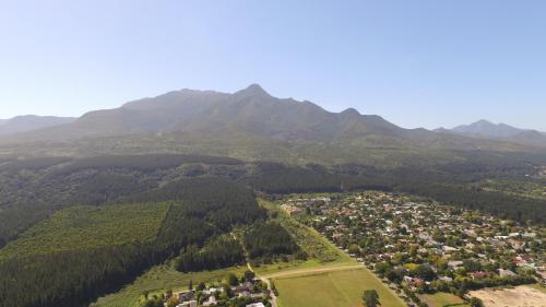 an aerial view of a village in the mountains at 15 Witpeer Street Guesthouse in George