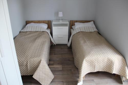 Postel nebo postele na pokoji v ubytování Ramotówka