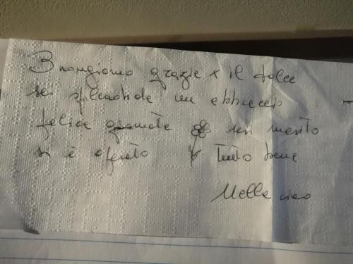 a piece of paper with handwriting on it at Roma Gianicolense in Rome