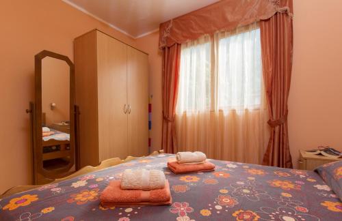 Postel nebo postele na pokoji v ubytování Djurovic Apartments Montenegro
