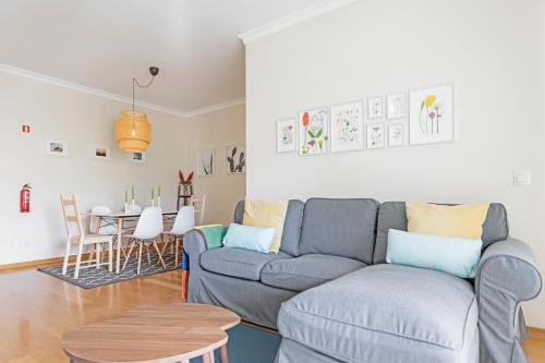 a living room with a couch and a table at Jasmineiro II by An Island Apart in Funchal