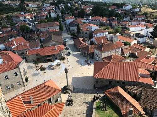an aerial view of a town with red roofs at Hotel Medieval® de Penedono in Penedono