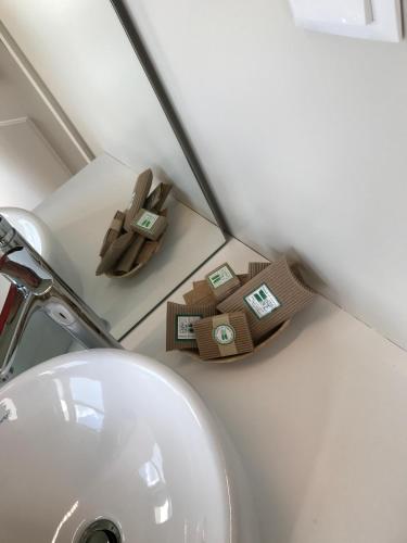 a bathroom counter with a sink and a towel holder at Hotel Medieval® de Penedono in Penedono