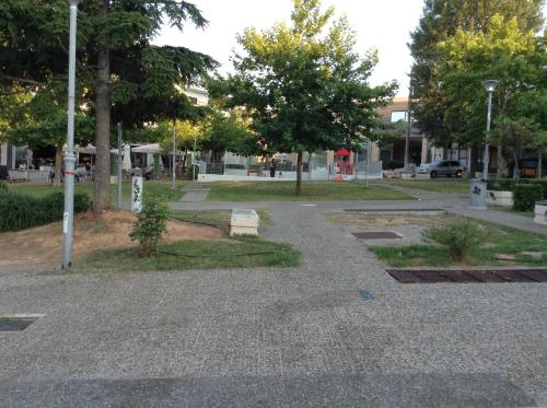 a park with trees and a walkway at Dina's House in Spáta
