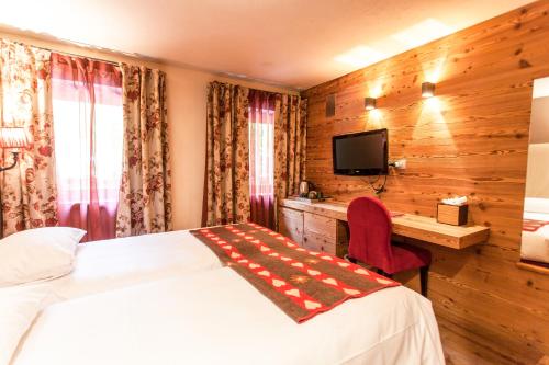 Chalet Eden Eco Hotel, Restaurant & Wellnessにあるベッド