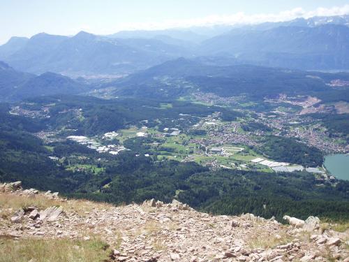 a view of a city from the top of a mountain at Guest House Dolomiti in Baselga di Pinè