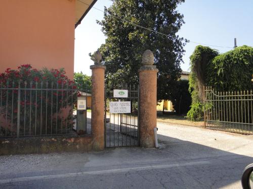 a wrought iron gate with a sign on it at Quo Vadis Qui Vieni in Rovigo