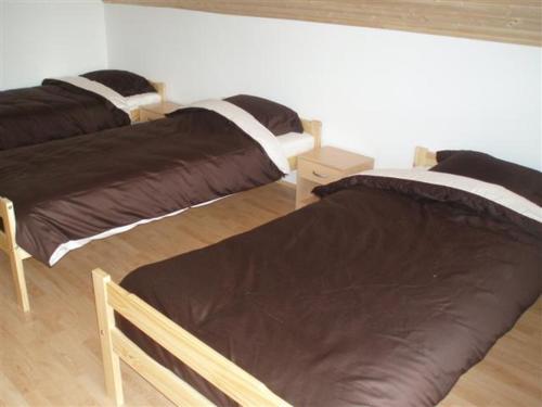 A bed or beds in a room at Balaton Villa Gyenes