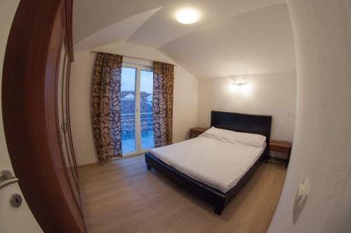 Postel nebo postele na pokoji v ubytování Apartments Leut