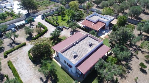 an overhead view of a house with a roof at Agriturismo Villa Tommaso in Torre dell'Orso