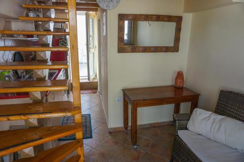 a living room with a couch and a table at Dolichi Studio in Samos