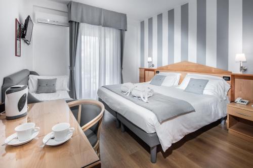 Кровать или кровати в номере Hotel Bellavista