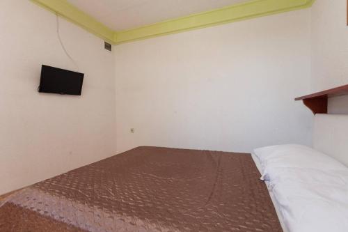Ένα ή περισσότερα κρεβάτια σε δωμάτιο στο Apartmani Antonella