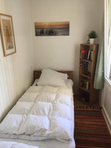 a bed sitting in a corner of a room at Ferienwohnung Marina Wendtorf in Wendtorf