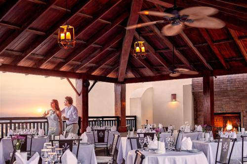 a bride and groom standing in the middle of a banquet hall at Steigenberger Aqua Magic, All inclusive in Hurghada