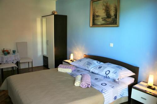 Postel nebo postele na pokoji v ubytování Apartments Milatic