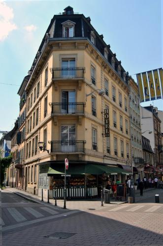 a large building on the corner of a street at Hotel Victoria in Strasbourg