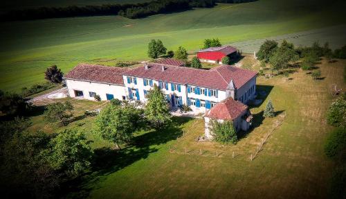 an aerial view of a large house in a field at Les Gîtes De Morville in Malaumont