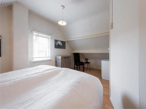 מיטה או מיטות בחדר ב-Catharina Texel