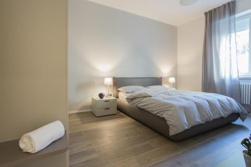 Una cama o camas en una habitación de C-Apartment Civico88