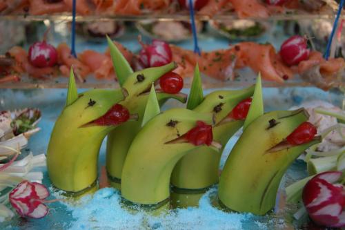 a cake with fruit in the shape of bananas at Hotel Sandra in Rimini