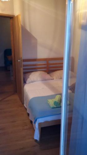 Postel nebo postele na pokoji v ubytování Apartment Greta