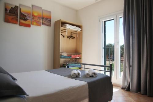 a bedroom with a bed with two stuffed animals on it at Villa Giulia&Gaia - Guest House in Nardò