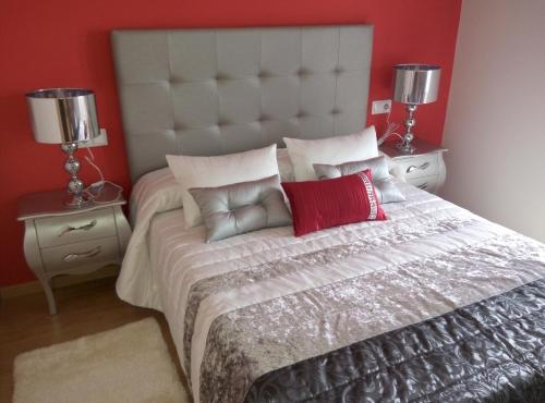 Ένα ή περισσότερα κρεβάτια σε δωμάτιο στο Vivienda de Uso Turístico Carballo Blanco 1