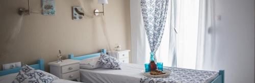 Ένα ή περισσότερα κρεβάτια σε δωμάτιο στο Πανσιόν Μαϊστράλι