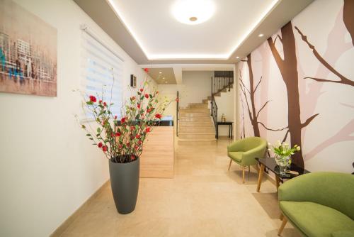 a hallway with a vase of flowers on the wall at Apartments Villa D&D in Slano