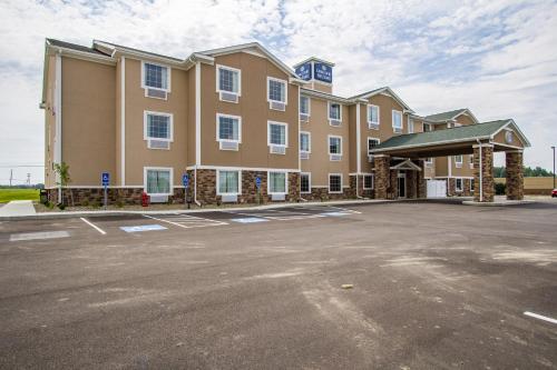 a rendering of a hotel with a parking lot at Cobblestone Hotel & Suites - Orrville in Orrville