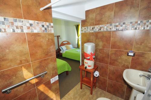 a bathroom with a shower and a sink in a room at Isla Azul in Puerto Ayora
