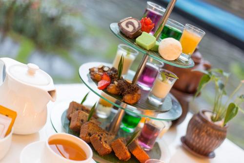 a table with two plates of food and drinks at Plataran Borobudur in Borobudur